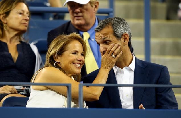 Katie Couric and fiance John Molner in a playful moment at the US Open